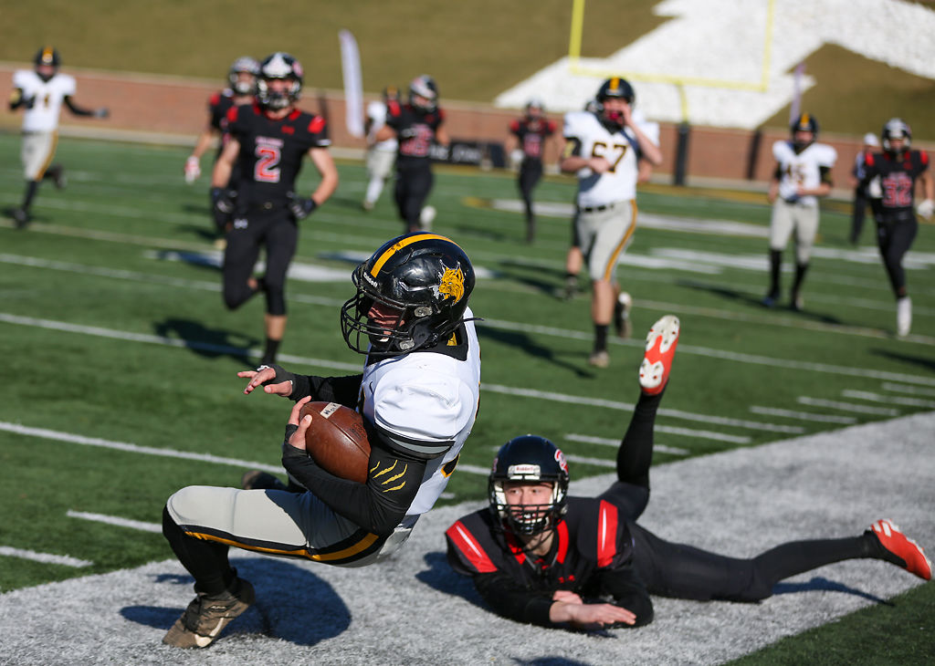 Cassville runner back Bowen Preddy is tripped up by Odessa player Wade Johnson
